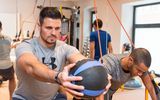 Two guests doing different exercises in the BiPhit fitness studio at the Platzl Hotel Munich